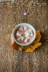 Coffee with marshmallow in a light blue cup