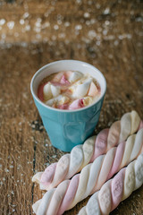 Coffee with marshmallow in a light blue cup