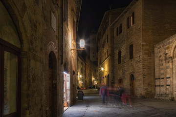 Fototapeta na wymiar Medieval streets of San Gimignano at night, Tuscany, Italy