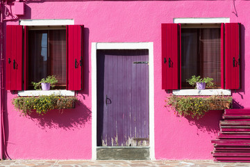 Colourfully painted house facade on Burano island, Italy