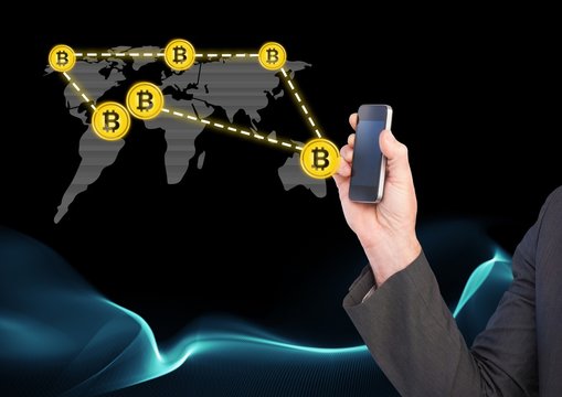 Bitcoin icons network on world map and hand holding phone