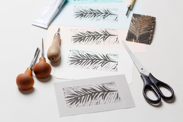 Greeting card on a dark wooden shabby background with old art tools. Top view