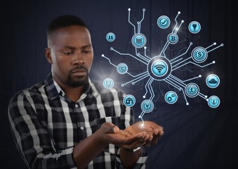 Businessman with hands palm open and various business icons