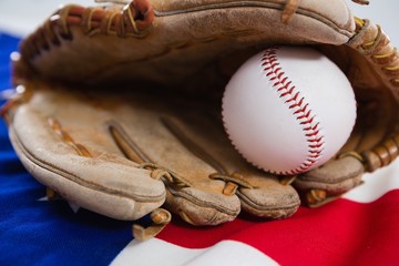 Baseball and gloves on an American flag