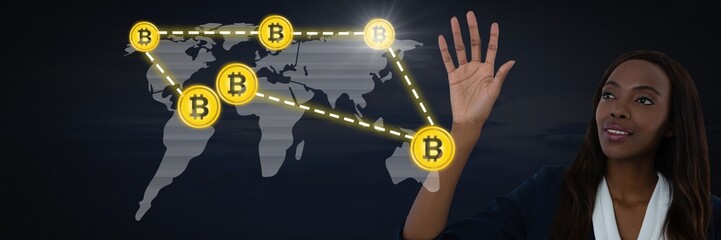 Businesswoman touching bitcoin graphic icon on world map