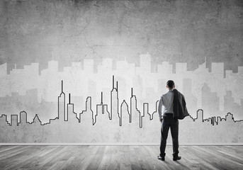 Silhouette of modern cityscape drawn on wall in room