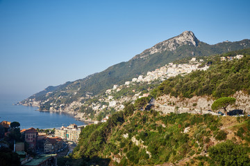 Fototapeta na wymiar View of the Amalfi coast in a clear summer sunny day with a view of the mountains, the sea and the towns