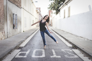 Classical ballerina dancing on the street dressed in casual clothes © txemag