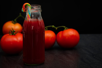 Still life of fresh ripe tomatoes juice