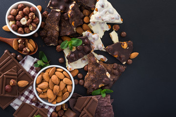 pieces of black and white chocolate with nuts