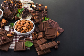 pieces of black and white chocolate with nuts