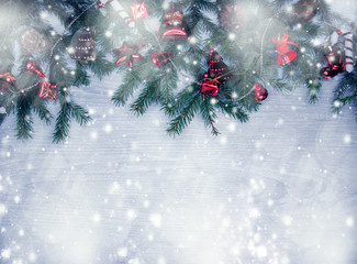 Naklejka na ściany i meble christmas decoration and snow on wooden background