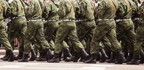 military men in green dress uniform marching to victory parade