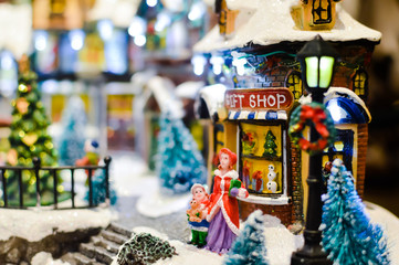 Christmas music cottage toy miniature for joyful seasonal decorated ornament background.