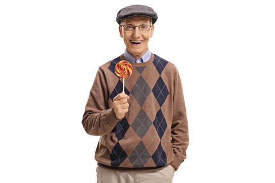 Senior holding a lollipop and smiling