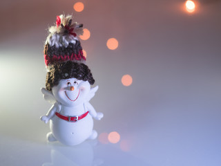 Cute snowman on a sparkle background