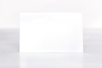 Blank business card mockup on a light background