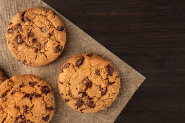 Chocolate chips cookies on baking paper with copyspace