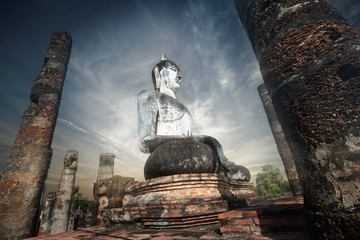 Giant statue of Buddha  in Wat Mahathat , Sukhothai , Thailand.