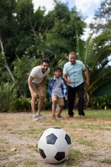 Family looking at soccer ball