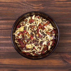 Spice mix - paprika and dried onion in a bowl on a wooden background