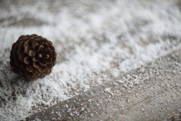 Pine cone wooden background