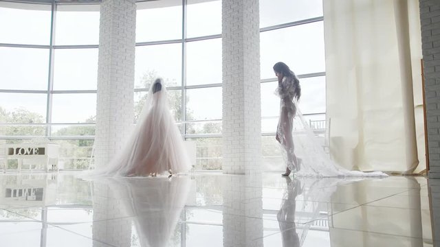 The bride wears a wedding dress in the morning