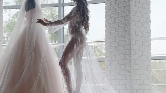 The bride wears a wedding dress in the morning