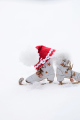Wooden made skates and Santa Claus hat. Closeup