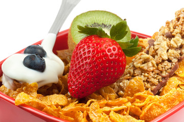 Corn flakes with berries and yogurt close up