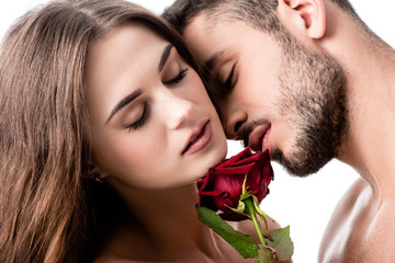 acctractive sensual couple with rose isolated on white