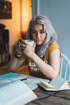 Dreamy woman with cup