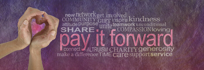 PAY IT FORWARD with love word cloud - campaign banner with female hands making a heart shape on...