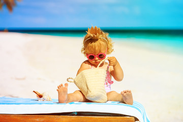 Obraz na płótnie Canvas cute little baby princess on beach