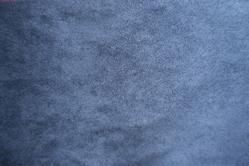 Surface of simple blue suede from above