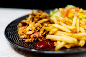 Fresh chicken steak with tomatoes and french fries