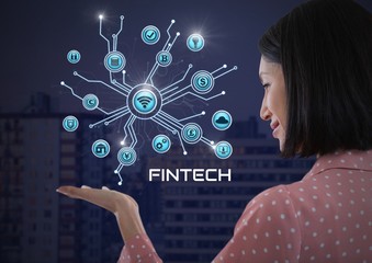 Businesswoman with hands palm open and Fintech with various