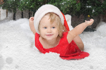 girl in santa costume on snow