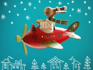 Christmas background with Santa Claus moose flying on an airplane
