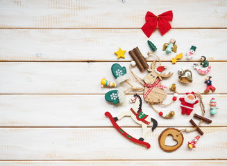 Funny Christmas ball on white wooden background