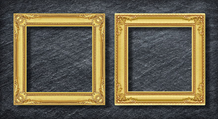 gold duo frame on Dark grey black slate background or texture.
