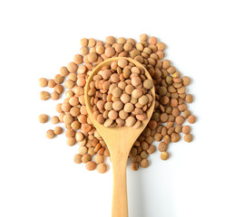 lentils in wood spoon on white background