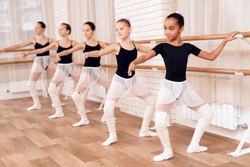 Young ballerinas rehearsing in the ballet class.