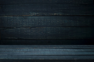 Old wood table top with smoke in the dark background.