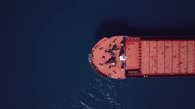 Cargo vessel prior to pickup global shipments merchandise - Aerial view | Empty container tanker - motion top view above | 4K UHD 