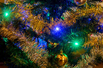 Obraz na płótnie Canvas The detailed look at Christmas decorations with lighting bulb on Christmas tree.