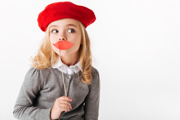 Portrait of a pretty little schoolgirl dressed in uniform