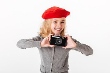 Portrait of a smiling little schoolgirl dressed in uniform