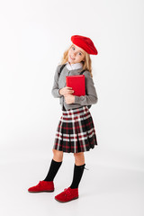 Full length portrait of a lovely little schoolgirl