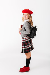 Full length portrait of a happy little schoolgirl